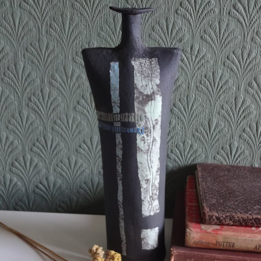 Theo. Abstract hand made ceramic art form in black stoneware clay.