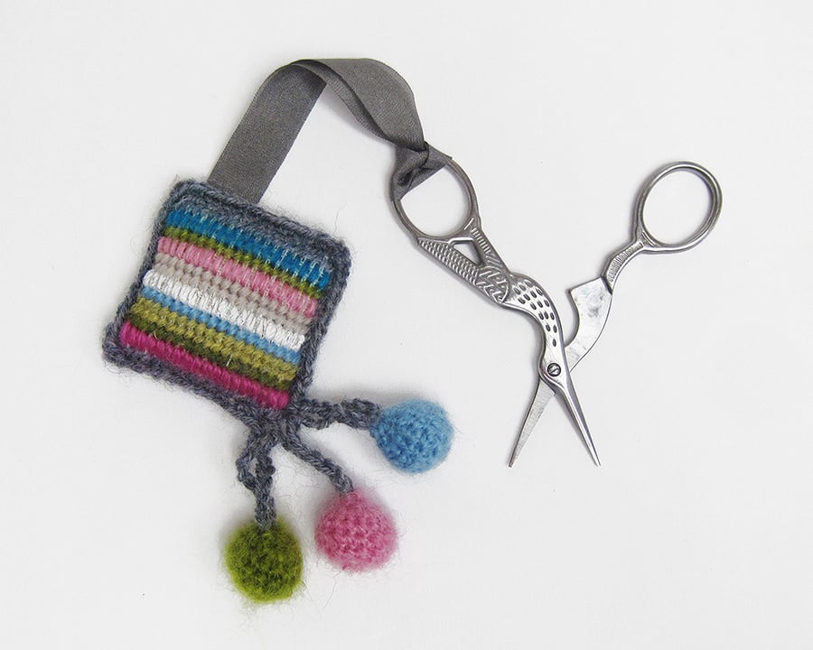 Scissor keeper with needlepoint stripes and crochet trim with balls
