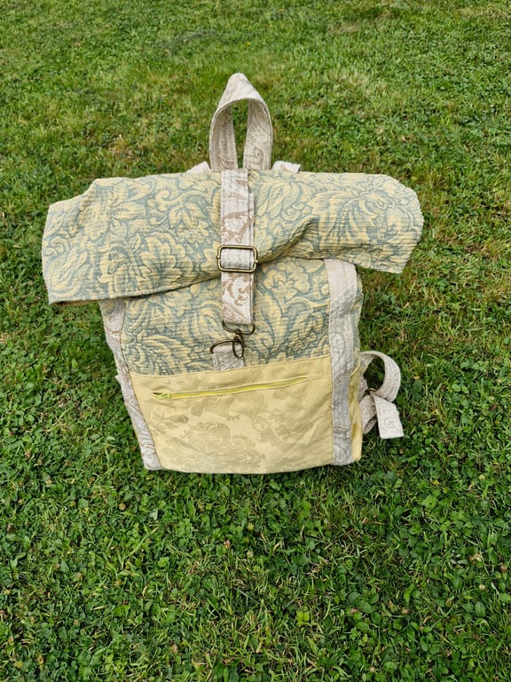 Large roll top rucksack with metal hardware