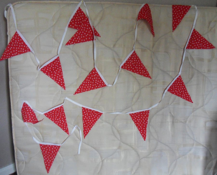 Homemade bunting. White stars on red background. 5 meters