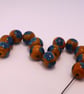 Handmade teal and mustard daisy patterned lamp work glass beads - Image 7