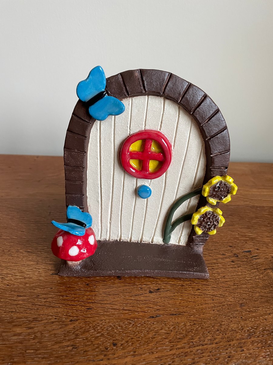 Magical fairy door with blue butterflies & sunshine yellow sunflowers