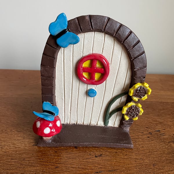 Magical fairy door with blue butterflies & sunshine yellow sunflowers