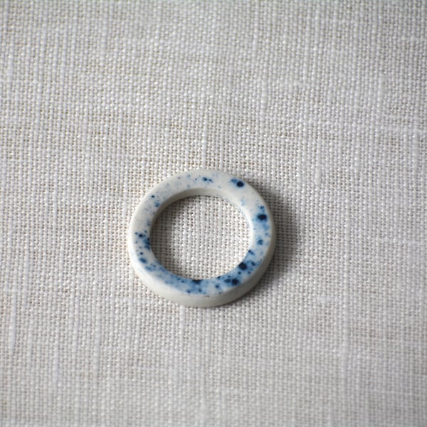 Porcelain ring with blue speckled detail