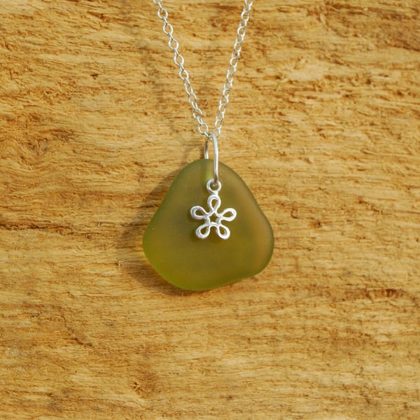 Olive beach glass pendant with little flower charm