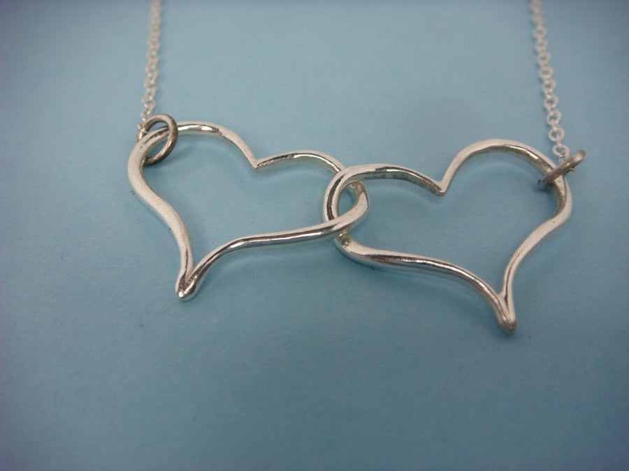 Double Heart pendant in fine silver with sterling silver trace chain.
