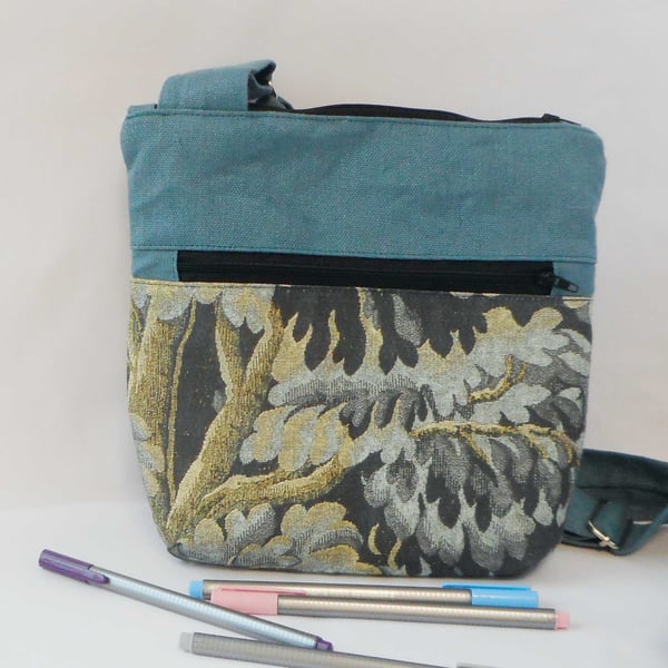 Fabric crossbody bag with zipped pocket on front