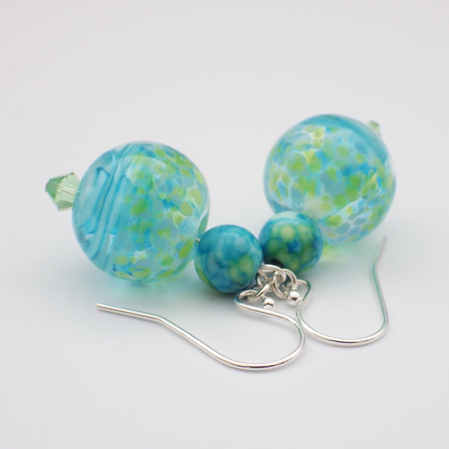Swirling blue and green UK lampwork glass bead earrings with rainflower stone