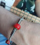 Upcycled and Re-Purposed Red Guitar String Bangle - Image 1