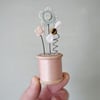 Clay Flowers and Bee on a Vintage Bobbin