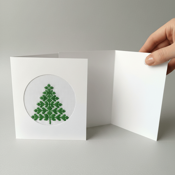 Hand-stitched Christmas card with embroidered green Christmas tree 