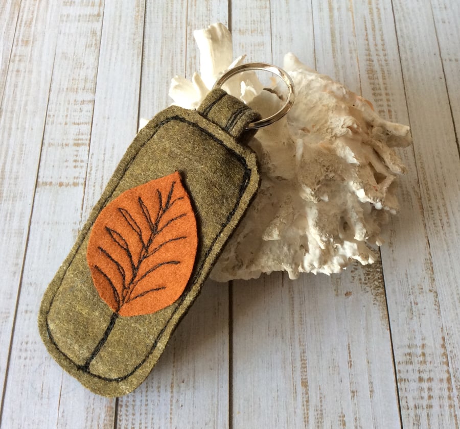 Up cycled embroidered leaf key ring.