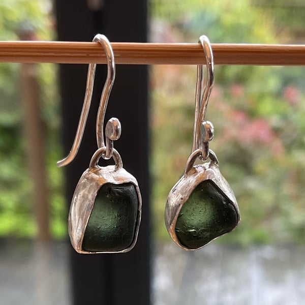 Beautiful deep rich green seaglass earrings set in silver.