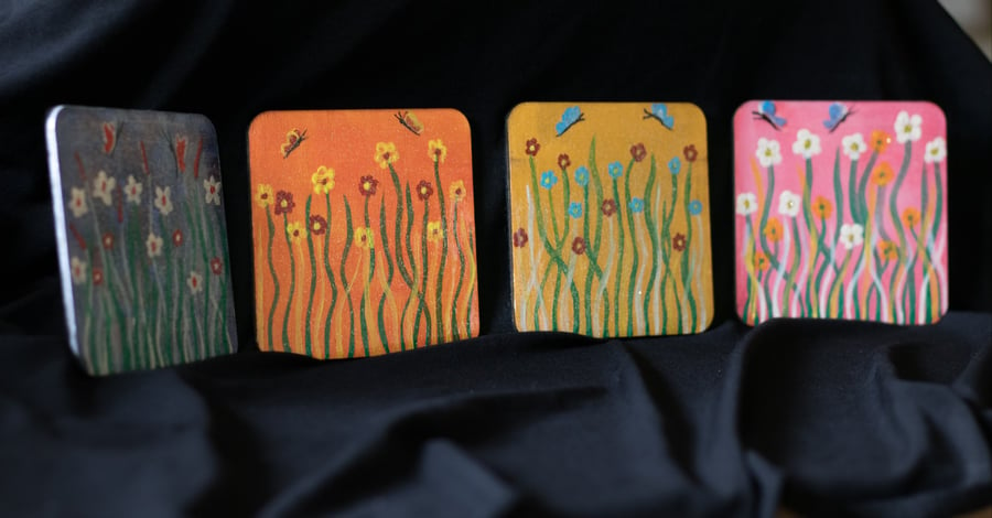 4 Beautiful flowers and butterfly coasters.Hand painted wood.