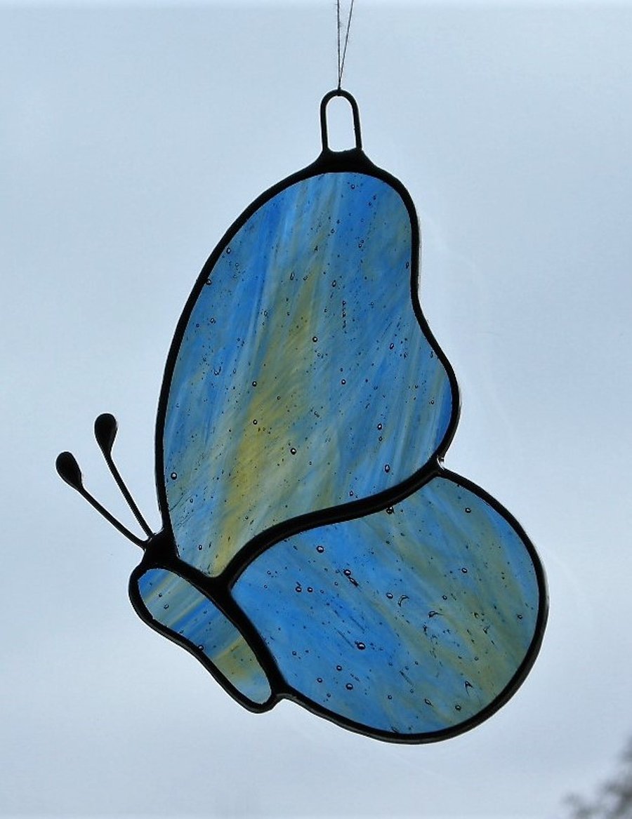Stained Glass suncatcher Butterfly in blue and amber streaky glass