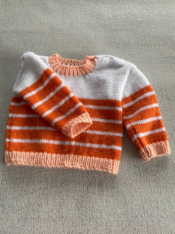 White, orange and peach striped baby jumper