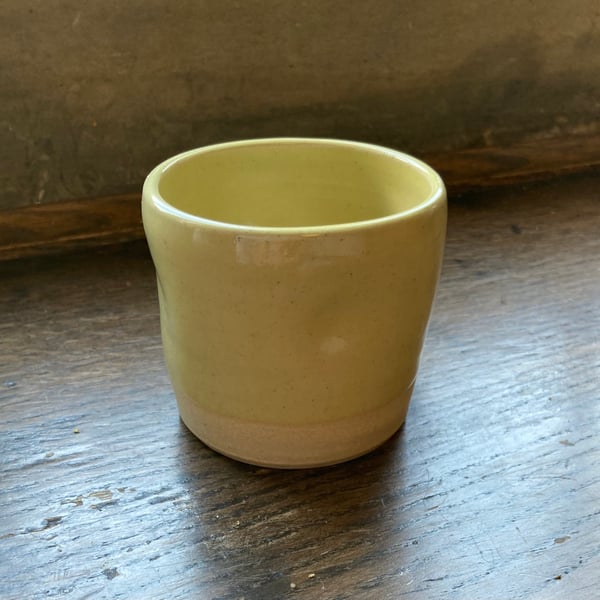 Small yellow finger dent cup