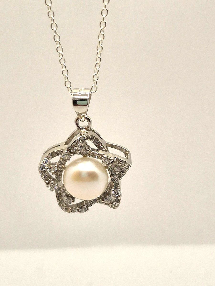 Sterling silver star pendant with freshwater pearl and cubic zirconia