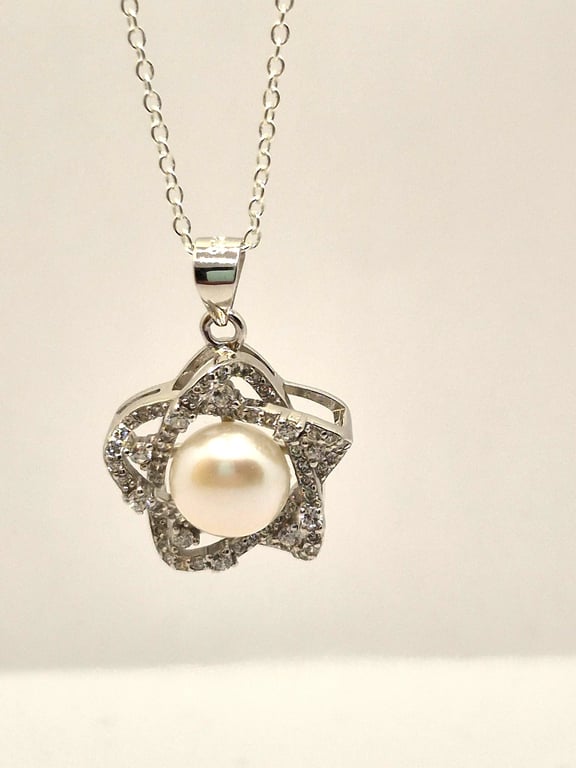 Sterling silver star pendant with freshwater pearl and cubic zirconia
