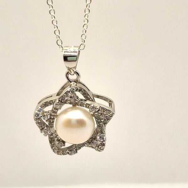 Sterling silver star pendant with freshwater pearl and cubic zirconia