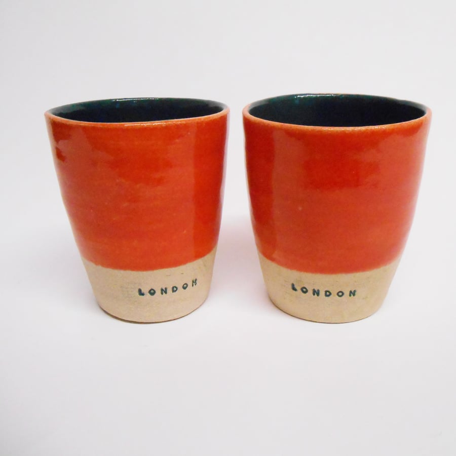 Tumblers Pair of London logo in Coral red and Tidepool Green.