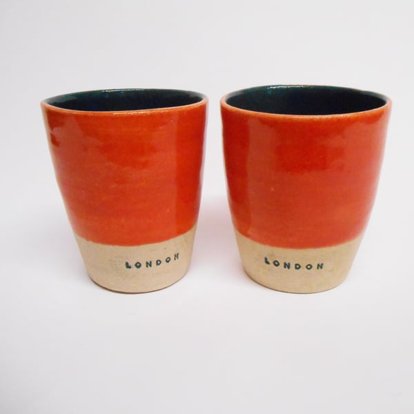 Tumblers Pair of London logo in Coral red and Tidepool Green.