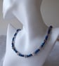 Blue Faceted Bead Necklace with Tibetan Silver flower accents