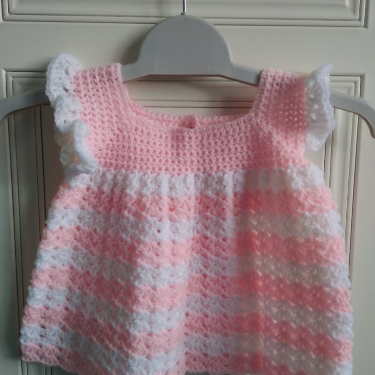 Baby dress crocheted in pink and white. Lovely gift for new baby girl. 20"chest