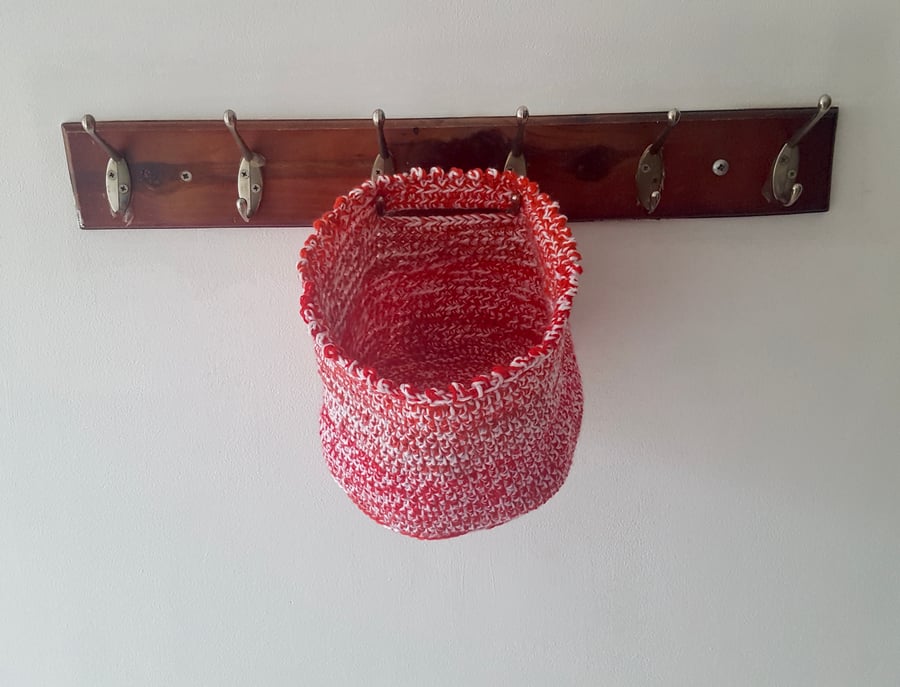 Hand made crochet hanging basket. Various shades of red and white. Sturdy.