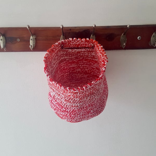 Hand made crochet hanging basket. Various shades of red and white. Sturdy.