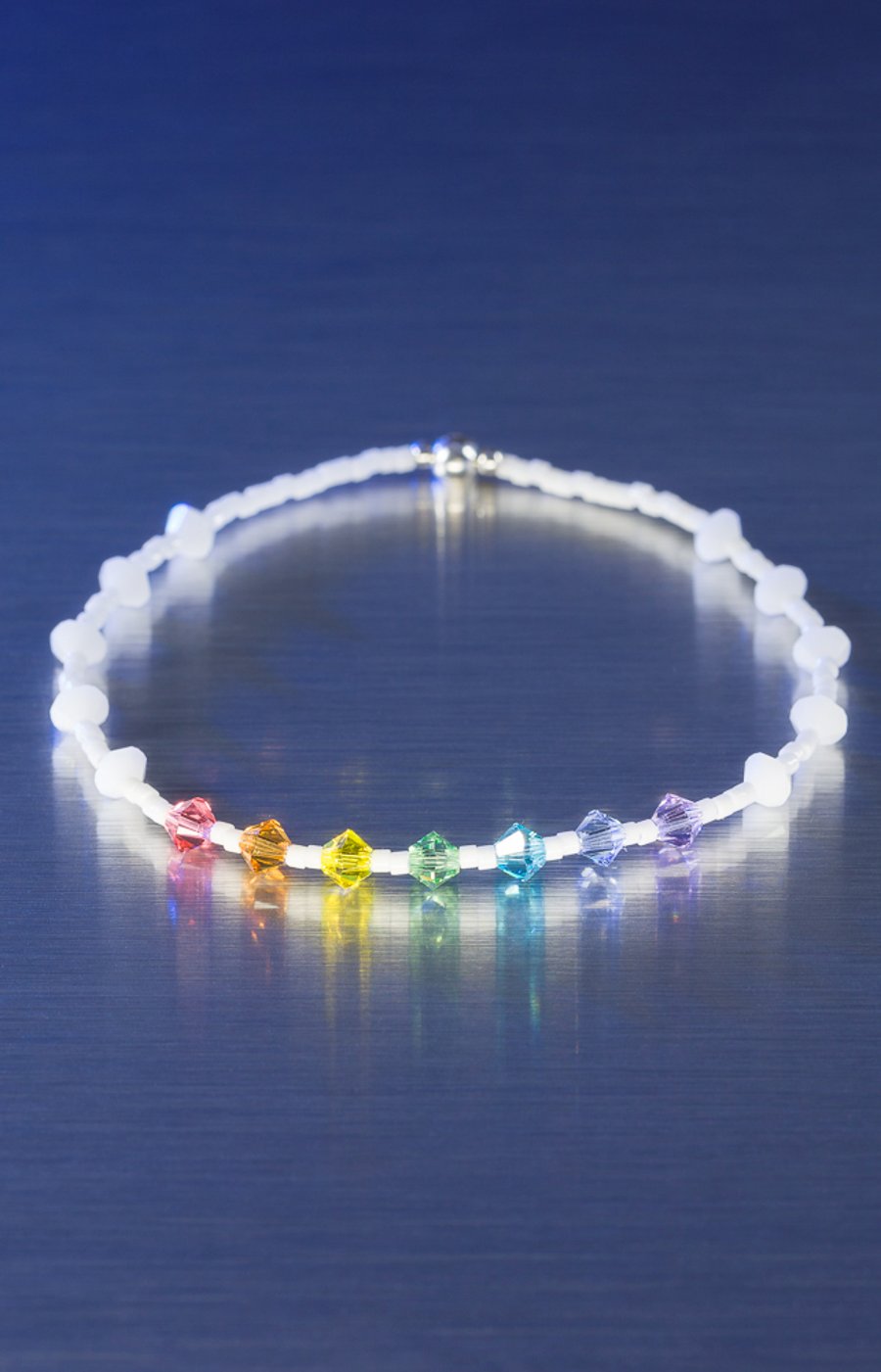 White Miyuki and Swarovski bracelet in rainbow chakra colours