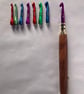Crochet hook set with 8 hooks sizes 3 to 7, with a  hardwood handle.