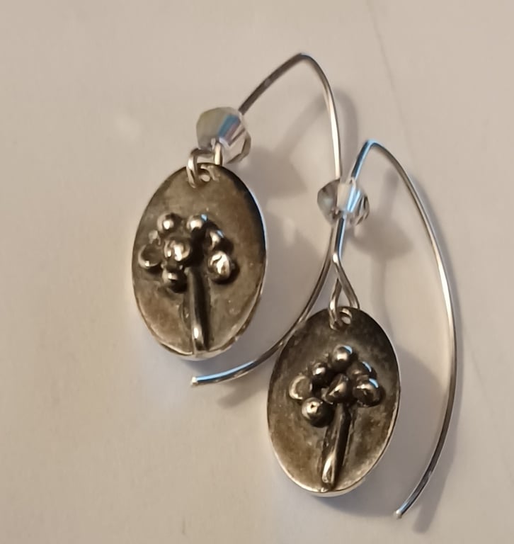 Silver flower oval earrings