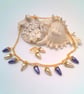 Purple and Cream Pearl Drop Beads on a Gold Plated Chain Necklace and Earrings - Image 1