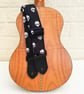 1.5 inch Wide Adjustable Ukulele Strap with Black and White Skulls - Image 1