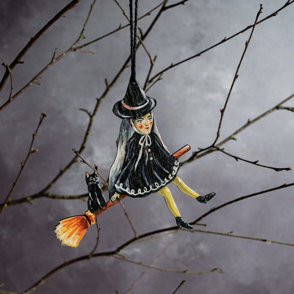 Witch on a broomstick hanging decoration