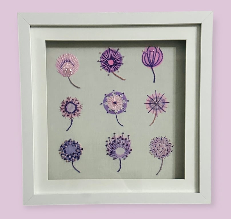 A framed floral hand painted and embroidered picture, mixed media, beaded