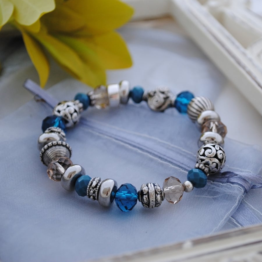 Silver and blue bead stretch bracelet