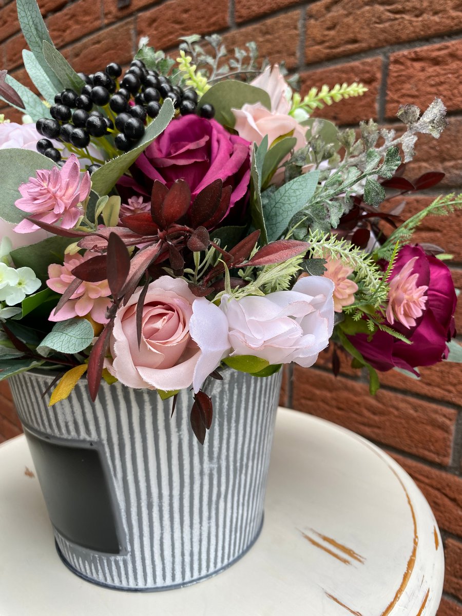 Mauve and pink artificial flower arrangement 