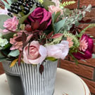 Mauve and pink artificial flower arrangement 