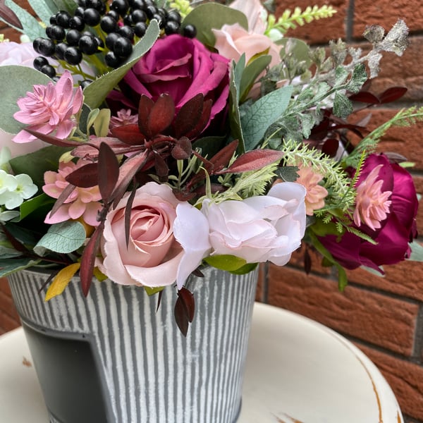 Mauve and pink artificial flower arrangement 