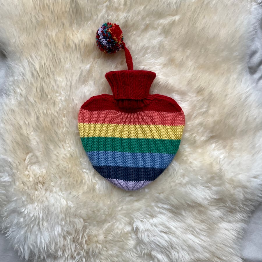 Heart shaped hot water bottle with hand knit cover 