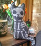 Spooky Crochet Cat Mini Cushion - Grey with white bones - Image 1