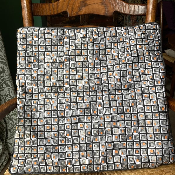 A pair of large square cushion covers.  Would look striking in the living room.
