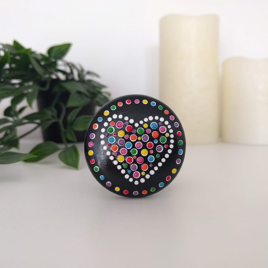 Colourful heart dot painted wooden pebble