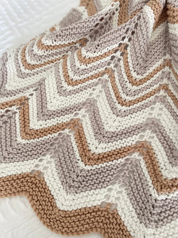 Grey, caramel and cream baby blanket in cotton mix yarn.
