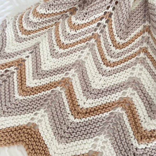 Grey, caramel and cream baby blanket in cotton mix yarn.