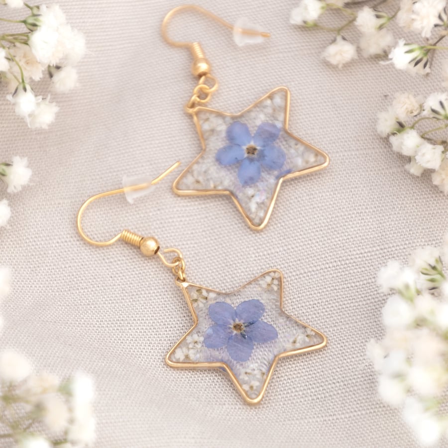 Gold star dangle earrings with real dried forget me not flowers in resin