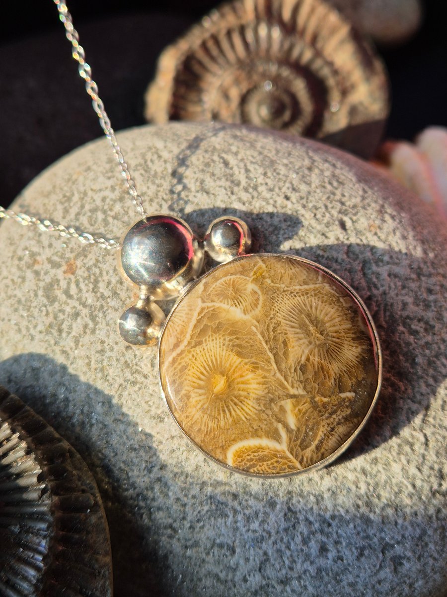 Handmade sterling silver and fossilised coral pendant