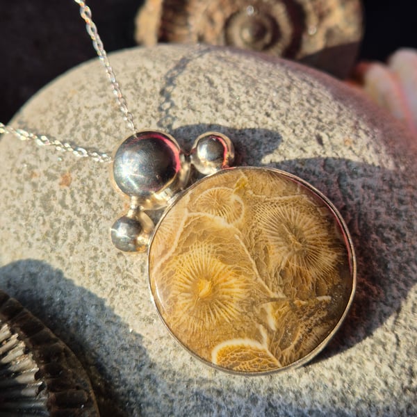 Handmade sterling silver and fossilised coral pendant